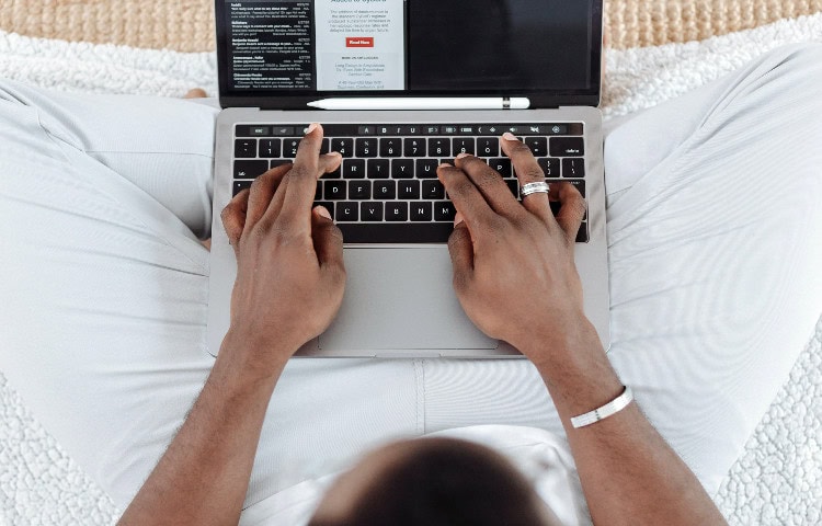 Man typing on a computer