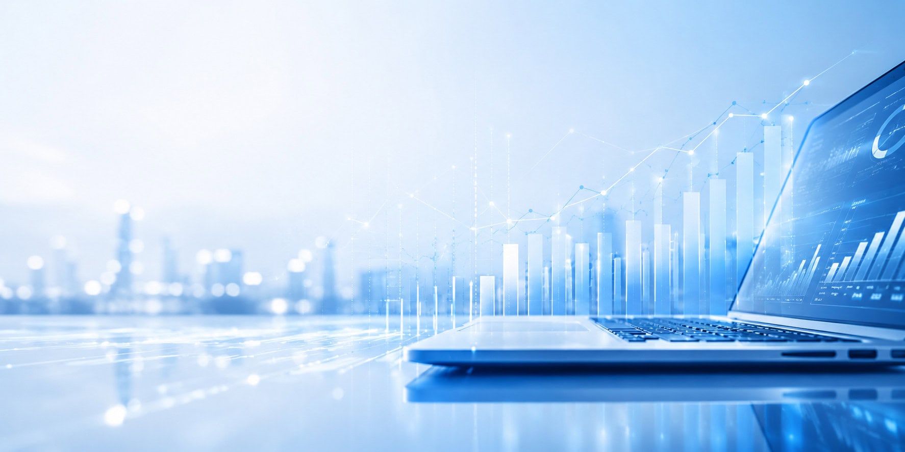 An open laptop displays rising bar and line charts, with a blurred city skyline in the background.